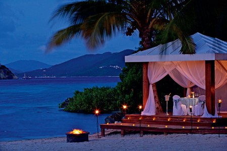 Beach Romance - hills, romantic, romance, steps, sand, coconuts, curtain, fire, gazebo, palm trees, candles, ribbons, tealights, water, lanterns, dishes, table, chair, stairs, lights, mountains