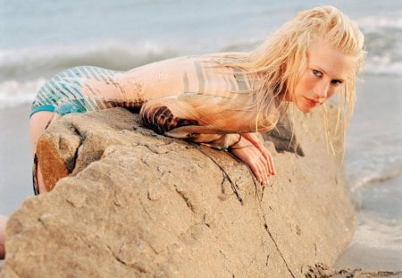 January Jones - stone, summer, blue, beach, january jones, tv series, girl, sea, blonde hair, beauty, ocean, actress, woman, movie, mad man, sexy