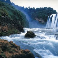 Waterfalls into River