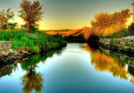 Autumn River - lagoon, lakescape, rivers, scene, scenario, parks, widescreen, trunks, plants, landscapes, seasons, heat, amber, riverscapes, beautiful day, house, hot, moss, gold, colors, stones, laguna, wonderful, gray, autumn, green, shadows, wall, waterscape, blue, yellow, amazing, roots, creek, leaves, red, view, border, effects, sky, clouds, water, photoshop, scenic, morning, cool, reflex, lightness, bright, foliage, scenery, perfect, light, nice, line, paysage, beauty, white, picture, paisage, brightness, lakes, pastel, reflections, evening, grass, photo, reflection, creeks, surface, mirror, paisaje, golden, branches, trees, image, beautiful, photography, orange, peisaje, ambar, paisagem, cenario, afternoon, awesome, cena, panorama, leaf, day