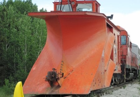 Train in the museum with snow removal 10 feet  - train, yellow, green, photography, orange, tree