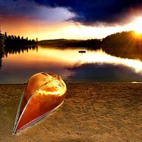 Upturned canoe at sunset