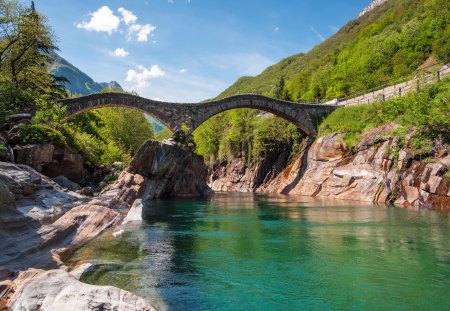 Old Footage Bridge - clouds, trees, water, rock, grass, forest, daylight, architecture, mountain, river, nature, day, sky, bridge