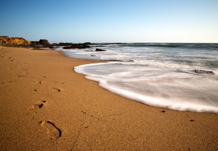 Footprints - clouds, beach, beautiful, splendor, sea, beauty, ocean, lovely, sand, nature, view, ocean waves, waves, footprints, peaceful, sky