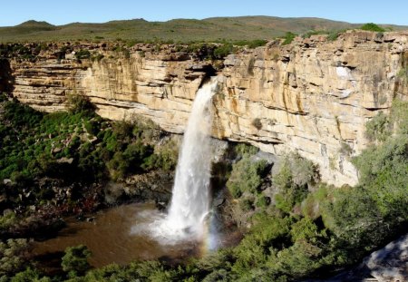 Unbelievable - waterfalls, water, falls, rock, grass, mountain, nature, cliff, dirt, day, sky