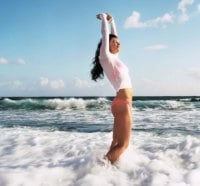 Beautiful girl in the waves of the sea