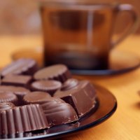 Cup of coffee and some chocolates