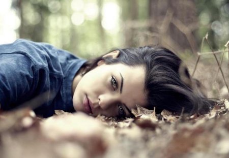 Sweetness in her eyes - pretty, pic, blue, sweetness, eyes, lying, forest, photo, leaves, face, brunette, image, beautiful, girl, sweet, hair, black, lips, nature, picture, wall, wallpaper