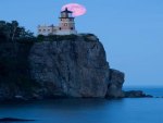 Pink Lighthouse Guides Ships Home