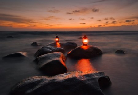 Sunset - beauty, sky, peaceful, candles, sunset, rocks, view, reflection, clouds, lamp, ocean, candle, lovely, nature, lamps, beautiful, splendor, colors, sea