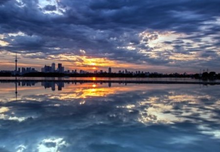 Reflection - blue, skyline, splendor, sunrise, reflection, view, skyscrapers, lake, sky, sun, clouds, water, beautiful, sea, city, beauty, colors, lovely, architecture, buildings, nature, sunset, peaceful, building