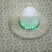 Fountain with a green light