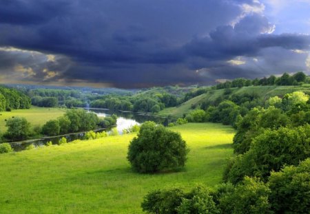 storm clouds over a winding river