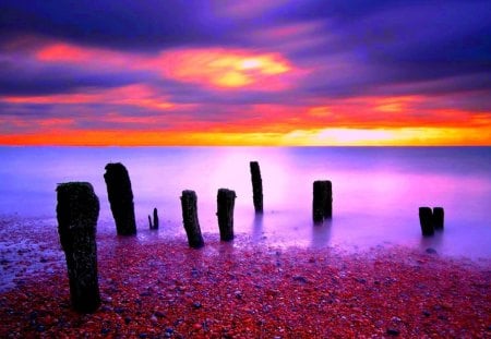 the most colorful sunset - ocean, sunset, piers, pebbles