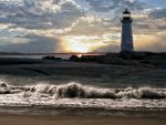 lighthouse on at sunset