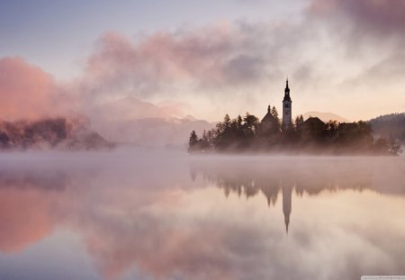 Fog Over Lake - forest, water, lake, sky, architecture, building, reflection, clouds, island, fog, trees, nature, mountain, day