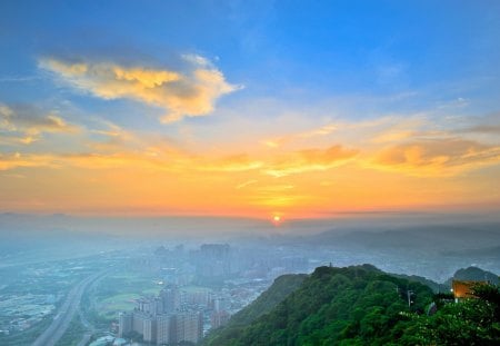 Lovely View - beauty, sky, trees, peaceful, sun, mountains, foggy, road, view, clouds, architecture, house, tree, morning, houses, building, landscape, sunlight, buildings, lovely, skyscrapers, nature, skyline, beautiful, city, fog, splendor, colors, sunrise