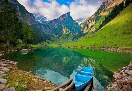 Mountain morning - sky, slope, trees, riverbank, mirrored, mountainscape, reflection, emerald, river, clouds, green, afternoon, boat, morning, lake, mountain, day, summer, shore, peaks, nature, blue, stones