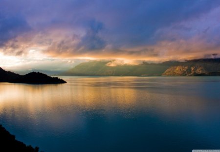 Panoramic View of the Lake - sky, lake, mountain, day, water, sunset, nature, yellow, reflection, smooth, clouds