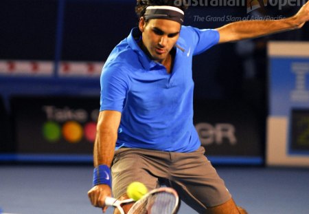 Roger Federer - male, yellow ball, blue t-shirt, raquet, tennis player, brown pant, playing