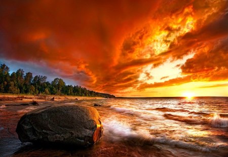 Blazing sunset - beach, dazzling, sundown, trees, water, blazing, sunset, shine, rocks, amazing, glowing, orange, rays, ocean, light, shore, lovely, waves, nature, bright, fiery, red, beautiful, stones, sunrise, sea