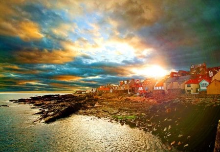 Coastal village - sky, sunshine, dazzling, sundown, peaceful, colorful, sunset, coast, cottages, sun rays, amazing, glowing, pretty, reflection, calmness, clouds, rays, houses, sunlight, shore, cabins, lovely, nature, village, town, red, beautiful, stones, sunrise