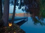 dock on a lake at sundown