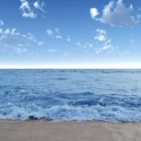 Foamy Waves on a Sandy Beach