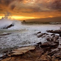 breaking waves on rocky seashore