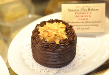 Small  chocolate cake with yellow stuff on top. - cake, yummy, food, chocolate