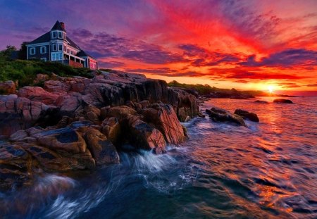 Sunset over the rocky coast - nice, sky, sundown, sun, colorful, sunset, coast, rocks, amazing, purple, reflection, evening, clouds, afternoon, ocean, shore, lovely, waves, glow, nature, red, beautiful, waters, sea