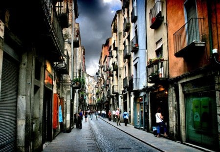 opening shops in a side street of girona - city, shops, side street, clouds