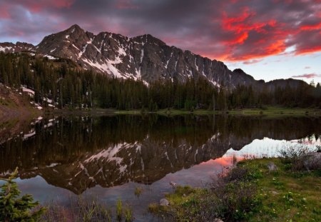 beautiful nature landscape - fire, lake, mountains, clouds