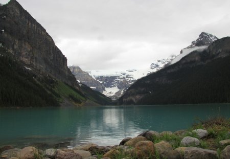 Lake Louise shore at Banff Alberta - snow, Lakes, mountains, rocks