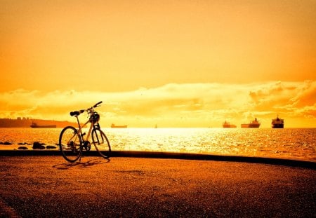 PARKED BICYCLE at SUNSET - pier, ships, sunset, bicycles, the sea