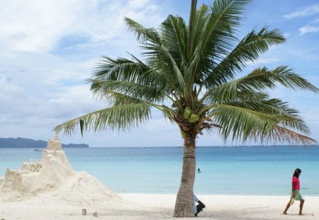 taking a break at building a castle - sand, palm, beach, castle, girl, guy