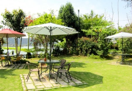 Garden restaurant - parasols, garden, lake, grass, restaurant