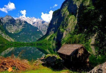 Flooded hut - nice, hut, lakeshore, cottage, sky, peaceful, riverbank, water, mountaun, mirrored, rocks, reflection, clouds, river, green, house, grass, rocky, lake, summer, shore, flooded, lovely, nature, beautiful, stones, cabin