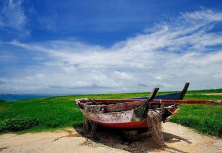 Abandoned Boat - clouds, green, boat, landscape, sea, grass, sand, sky