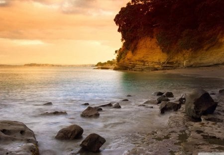 Beach View - beach, sky, ocean, daylight, cliff, day, water, sunset, nature, brown, yellow, clouds, rock