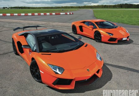 12-Lamborghini-Aventador - two cars, black wheels, orange, lambos