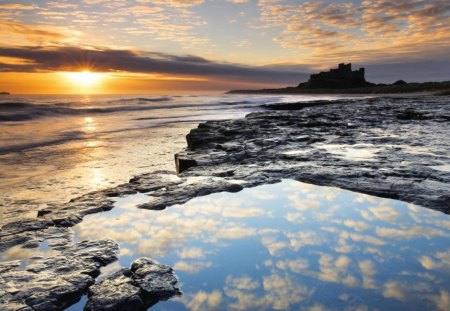 sunrise on bamburgh castle in england - castle, sunset, sea, sunrise, coast, rocks