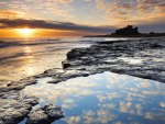 sunrise on bamburgh castle in england