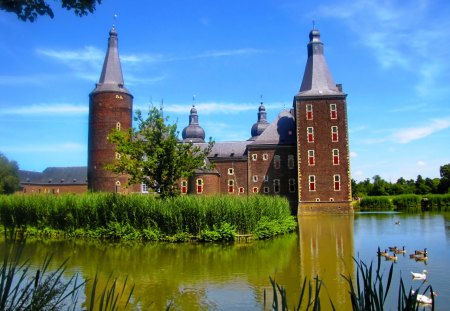 Castle on small island - nice, sky, riverbank, peaceful, calm, reflection, river, clouds, castle, grass, pond, birds, lake, summer, lovely, nature, ducks, beautiful, island