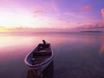 lone boat on a peaceful sea