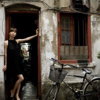 girl at the back door of a chinese restauant