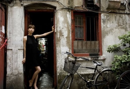 girl at the back door of a chinese restauant - restaurant, door, bikes, gilr