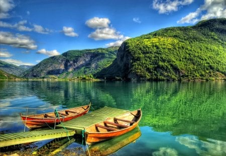 Ready for summer walk - summer, canoes, reflection, walk, crystal, mountain, calmness, shore, riverbank, lake, nice, emerald, sky, clouds, greenery, trees, beautiful, mirrored, lovely, lakeshore, boats, colorful, river, nature, green, clear, peaceful