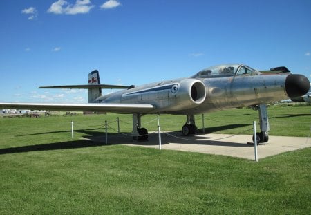 Airplane at the museum Alberta 26 - silver, black, grass, blue, sky, airplane, clouds, military, green