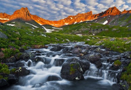 Mountain Thaw - sky, mountains, rocks, river, thaw, snow, grass